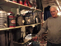 Former New Delphos Manufacturing employee Elmer Hoffman looks over gas cans.